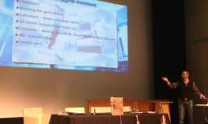Scott Baker explaining information displayed on a slide.