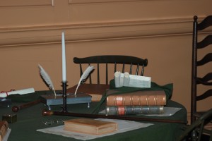 Old writing tools, old books and a table