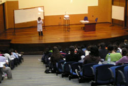 A person giving a presentation in an auditorium