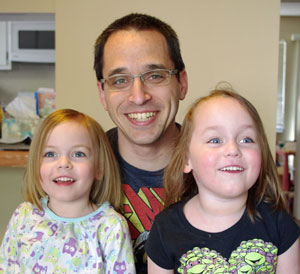 Andy Goldman and his twin daughters