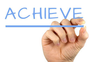 A hand and the world 'Achieve'