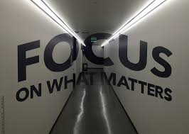 The words: Focus on what matters and a corridor